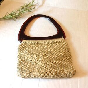 Macrame handbag with acrylic triangle handles